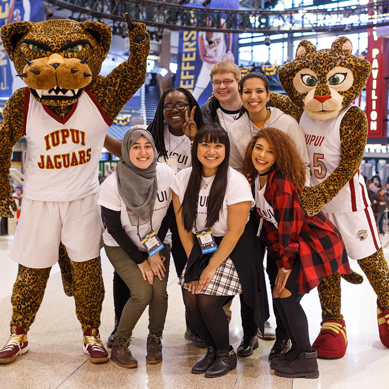 Students with Jaws and Jazzy at a Pacers game.